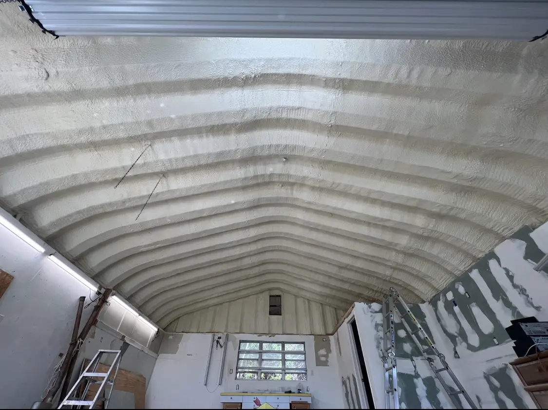 Spray polyurethane foam applied to the underside of a metal roof deck in Midway